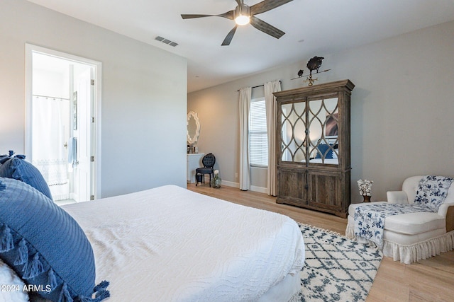 bedroom with ceiling fan and light wood-type flooring