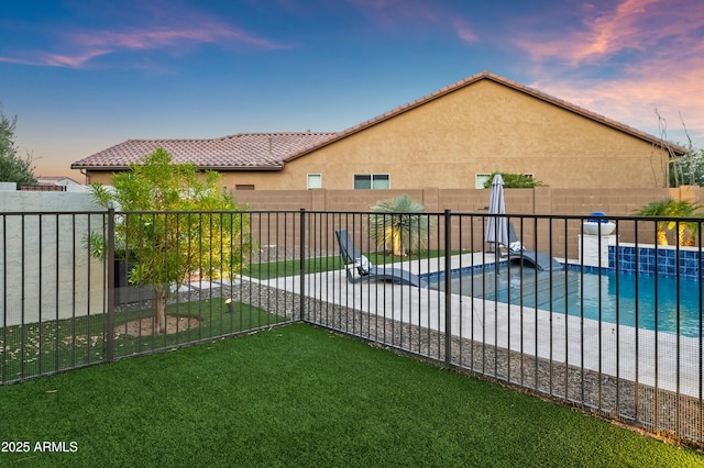 16987 W Princeton Ave, Goodyear, AZ 85395 - pool at dusk with a fenced backyard and a patio