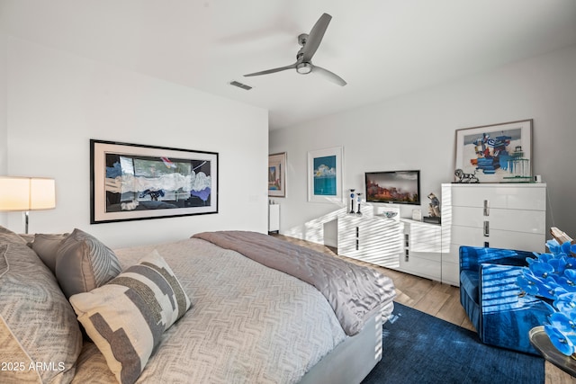 16987 W Princeton Ave, Goodyear, AZ 85395 - bedroom with wood finished floors and a ceiling fan
