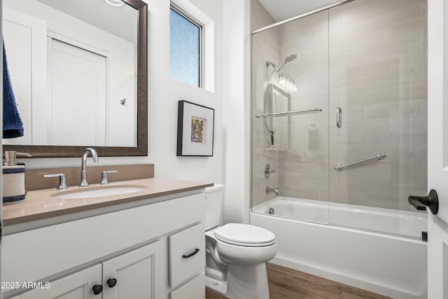 16987 W Princeton Ave, Goodyear, AZ 85395 - full bathroom with vanity, shower / bath combination with glass door, and wood finished floors