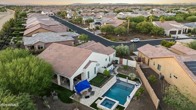 16987 W Princeton Ave, Goodyear, AZ 85395 - aerial view at dusk of a residential view and view of pool
