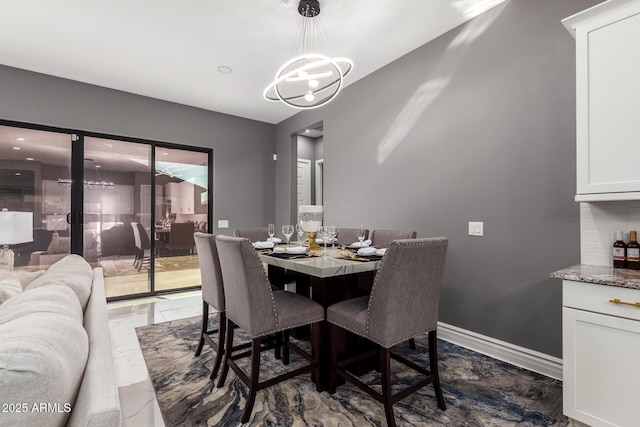 dining space featuring an inviting chandelier