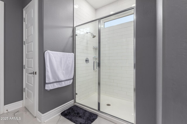 bathroom with a shower with shower door