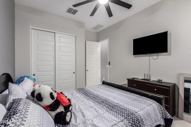 bedroom with ceiling fan and a closet