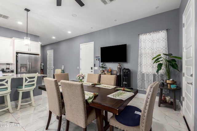 dining space featuring ceiling fan