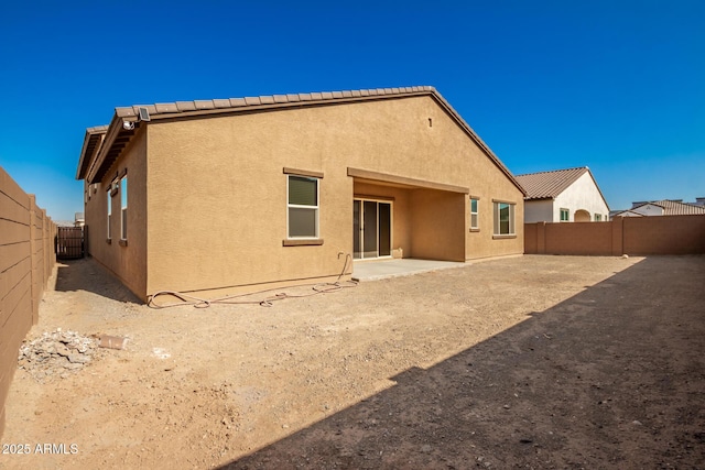 rear view of house featuring a patio