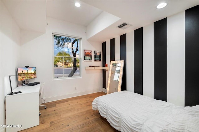 bedroom with light wood-type flooring