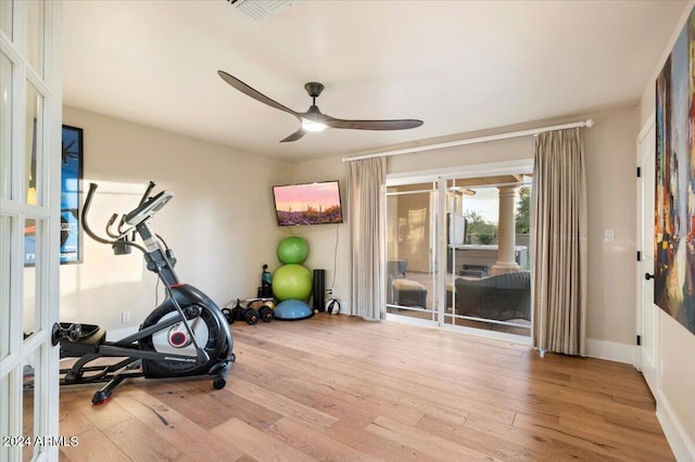 workout area with light wood-type flooring and ceiling fan