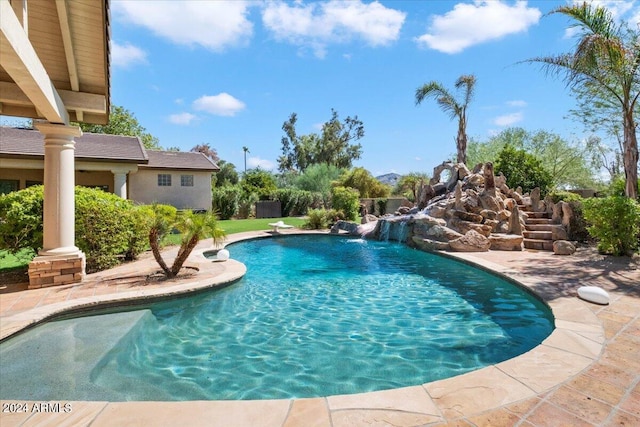 view of pool with pool water feature