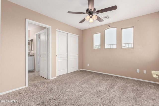 22337 E Via Del Palo, Queen Creek, AZ 85142 - unfurnished bedroom featuring a closet, a ceiling fan, baseboards, light colored carpet, and visible vents