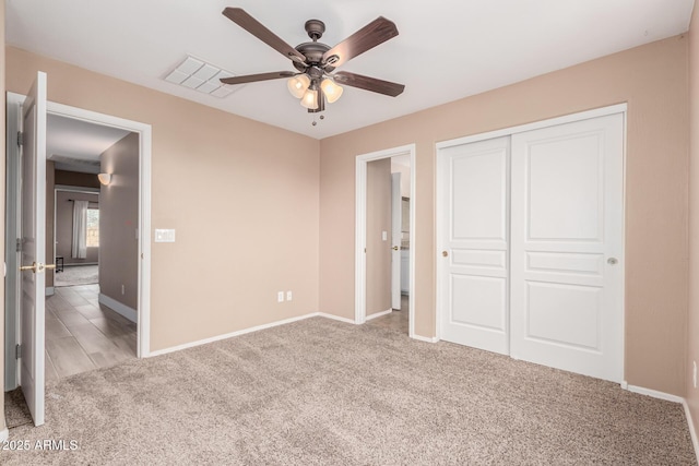 22337 E Via Del Palo, Queen Creek, AZ 85142 - unfurnished bedroom with a closet, carpet flooring, a ceiling fan, baseboards, and visible vents