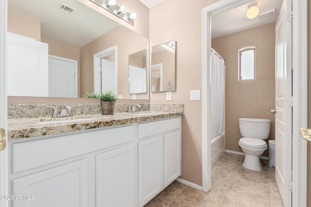 22337 E Via Del Palo, Queen Creek, AZ 85142 - bathroom featuring a sink, double vanity, visible vents, and toilet
