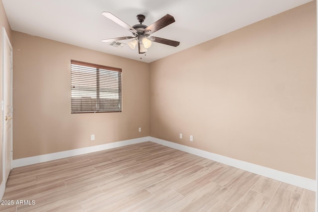 22337 E Via Del Palo, Queen Creek, AZ 85142 - empty room with baseboards, light wood-style flooring, and ceiling fan