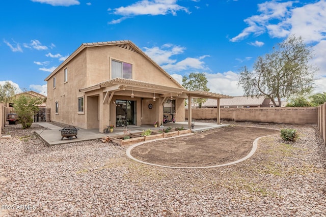 22337 E Via Del Palo, Queen Creek, AZ 85142 - back of house featuring a fenced backyard, an outdoor fire pit, stucco siding, and a patio area