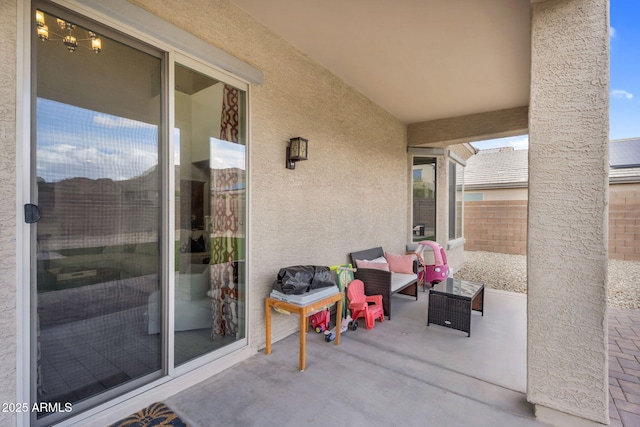 view of patio featuring fence