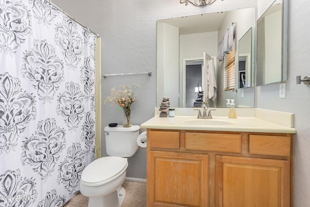 bathroom with tile patterned flooring, vanity, toilet, and a shower with curtain