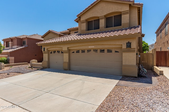 mediterranean / spanish-style house featuring a garage