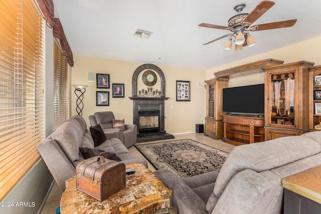 living room with ceiling fan and tile patterned floors