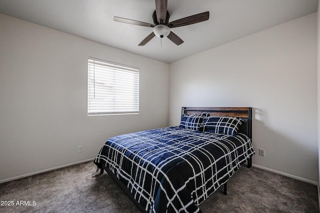 bedroom featuring dark colored carpet and ceiling fan