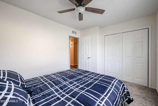 bedroom with ceiling fan, a closet, and carpet