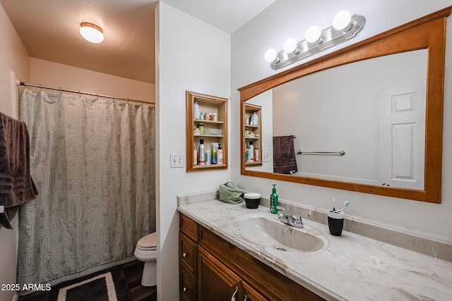 bathroom featuring vanity and toilet