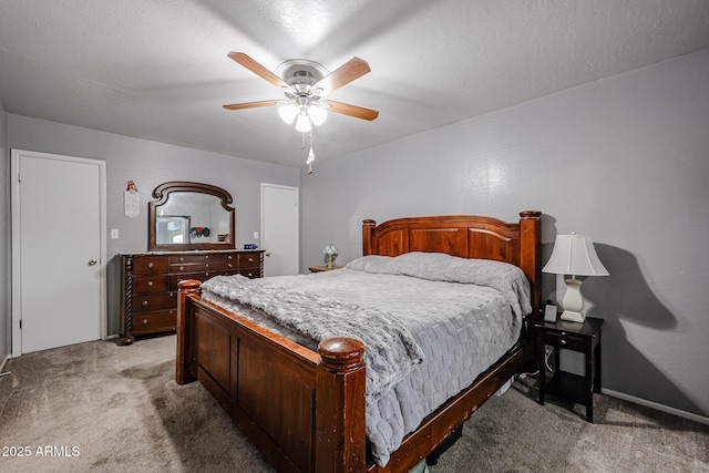 bedroom with carpet flooring, a textured ceiling, and ceiling fan