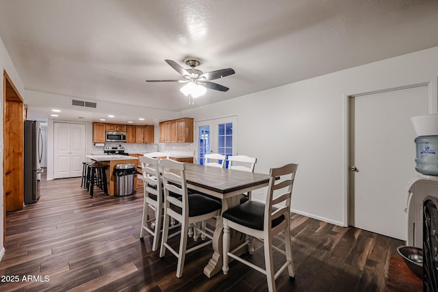 dining area with french doors, ceiling fan, dark hardwood / wood-style flooring, and sink