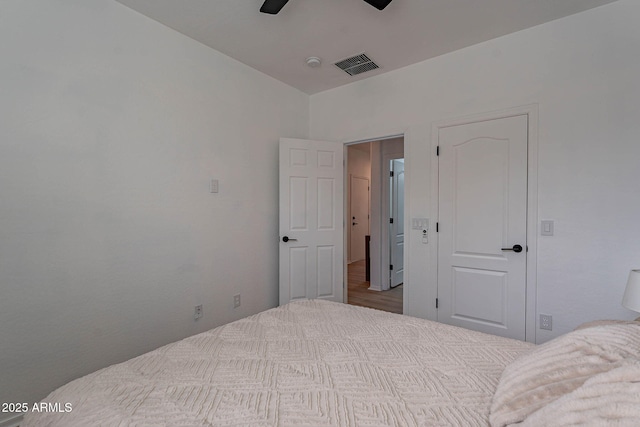 bedroom with visible vents and a ceiling fan