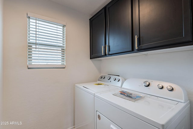 laundry area with cabinet space and independent washer and dryer