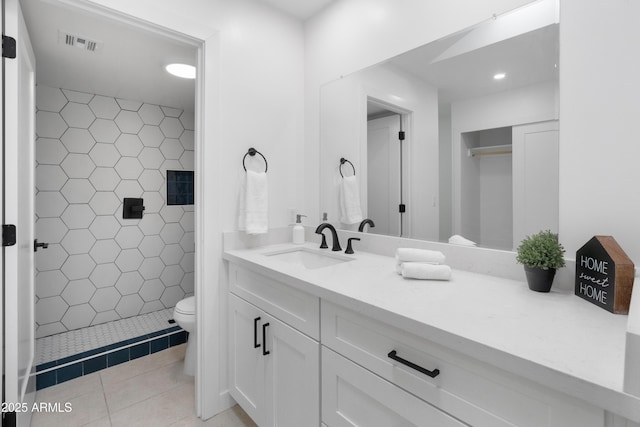 2935 N 68th St Unit 205, Scottsdale, AZ 85251 - full bath featuring vanity, a shower stall, tile patterned flooring, and recessed lighting