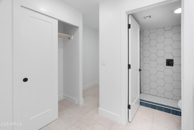 2935 N 68th St Unit 205, Scottsdale, AZ 85251 - bathroom featuring a shower stall and tile patterned floors
