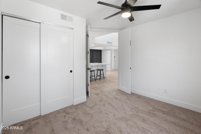 2935 N 68th St Unit 205, Scottsdale, AZ 85251 - unfurnished bedroom with carpet, a closet, and a ceiling fan