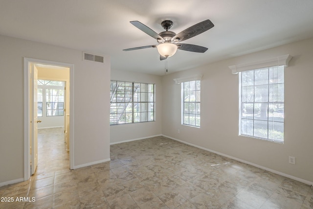 2333 E Southern Ave Unit 1023, Tempe, AZ 85282 - unfurnished room with baseboards and ceiling fan