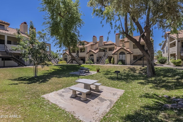 2333 E Southern Ave Unit 1023, Tempe, AZ 85282 - view of community with stairway and a lawn