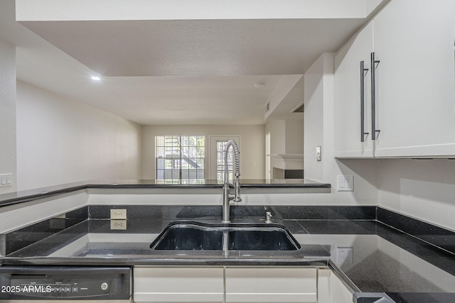 2333 E Southern Ave Unit 1023, Tempe, AZ 85282 - kitchen with dishwasher, white cabinets, and dark stone countertops