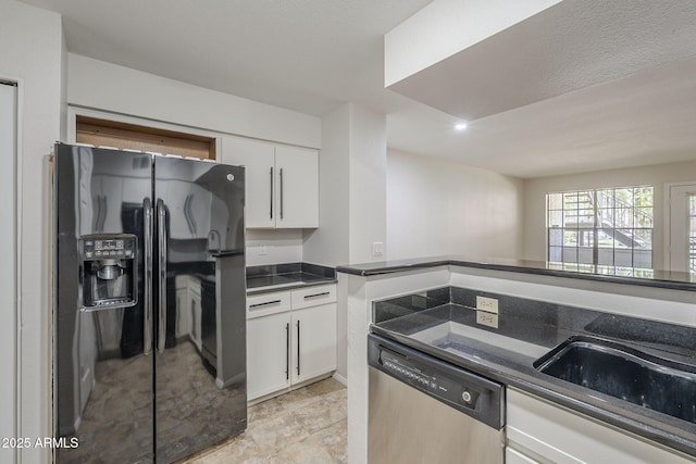2333 E Southern Ave Unit 1023, Tempe, AZ 85282 - kitchen featuring dishwasher, black fridge with ice dispenser, dark countertops, and white cabinetry
