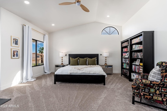 carpeted bedroom with ceiling fan, vaulted ceiling, and multiple windows