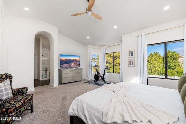 bedroom with light carpet, vaulted ceiling, and ceiling fan