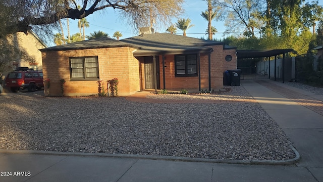 single story home with a carport