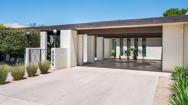 4336 E Piccadilly Rd, Phoenix, AZ 85018 - entrance to property featuring stucco siding and driveway
