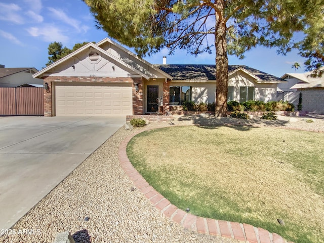 ranch-style house featuring a garage and a front yard