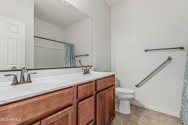 full bathroom featuring double vanity, toilet, baseboards, and a sink
