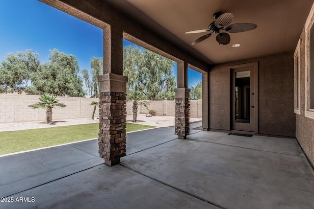 view of patio featuring a fenced backyard and a ceiling fan