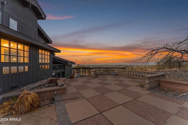 view of patio terrace at dusk