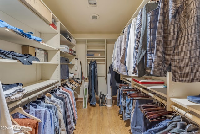 spacious closet with light wood finished floors and visible vents