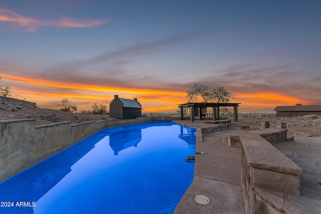 pool with a gazebo and a patio