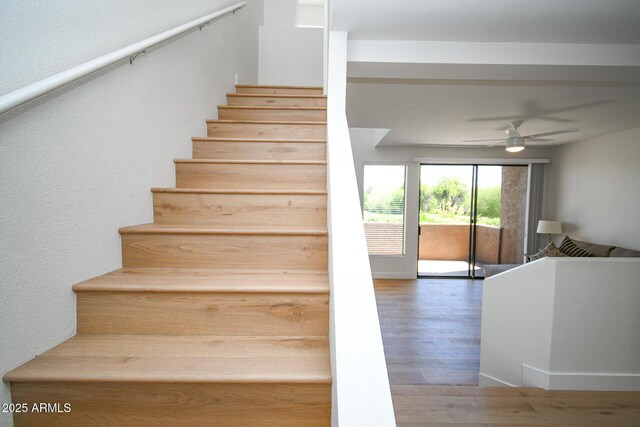 5122 E Shea Blvd Unit 1043, Scottsdale, AZ 85254 - stairway featuring wood finished floors and a ceiling fan