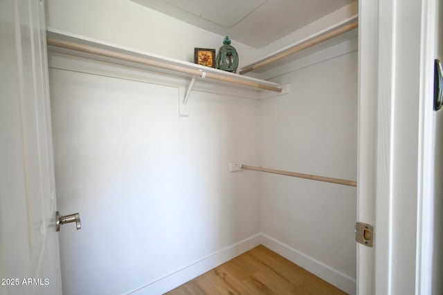 5122 E Shea Blvd Unit 1043, Scottsdale, AZ 85254 - walk in closet featuring light wood-type flooring