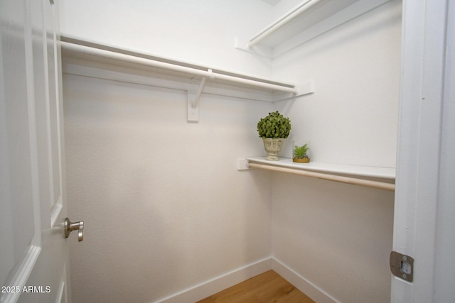 5122 E Shea Blvd Unit 1043, Scottsdale, AZ 85254 - walk in closet featuring light wood-style flooring