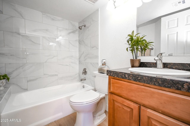 5122 E Shea Blvd Unit 1043, Scottsdale, AZ 85254 - bathroom with toilet, vanity,  shower combination, and wood finished floors